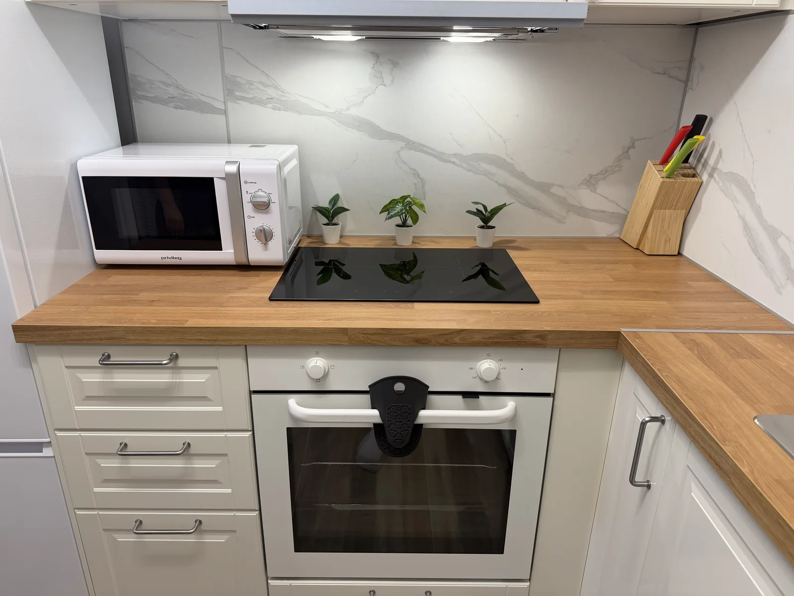 Kitchen counter with hob and oven